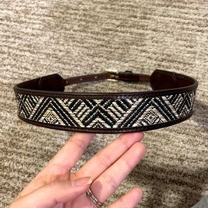 Tory Burch above the waste belt